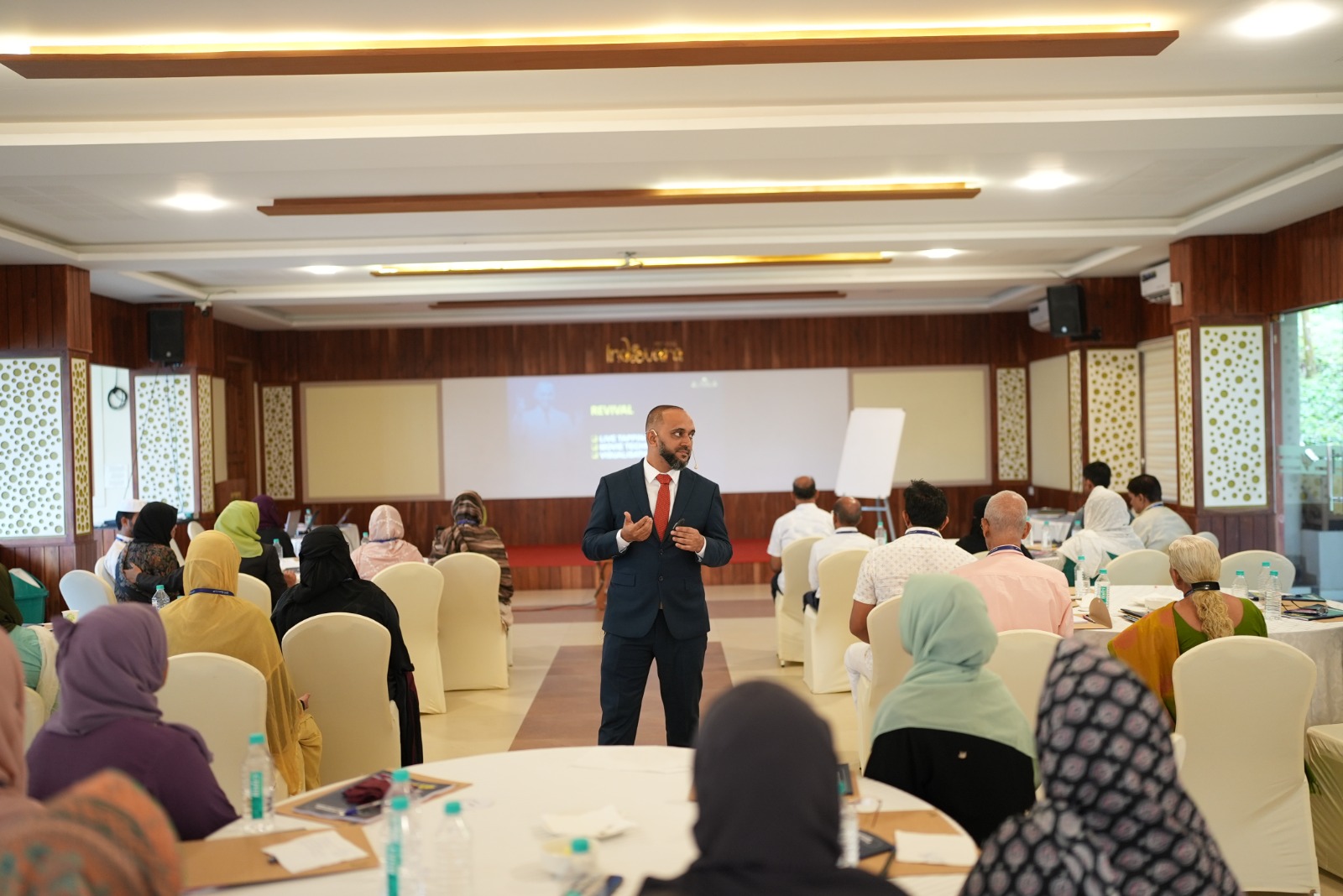 Full session hall — retreat in progress
